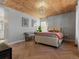 Serene main bedroom featuring a wood ceiling, modern decor, and herringbone wood floors at 2755 Geneva St, Denver, CO 80238