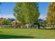 A neighborhood playground with climbing structures, slides, and green space for children to enjoy at 2755 Geneva St, Denver, CO 80238