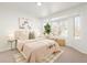 Bright bedroom with neutral decor and large window at 17990 E Dickenson Pl, Aurora, CO 80013