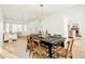 Dining area with farmhouse table and view to living room at 17990 E Dickenson Pl, Aurora, CO 80013