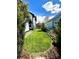 Landscaped backyard featuring a lush green lawn, mature trees, and backyard privacy at 2831 Shadow Lake Rd, Lafayette, CO 80026