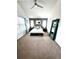 Spacious bedroom with neutral carpet, large windows, and a king-sized bed at 2831 Shadow Lake Rd, Lafayette, CO 80026