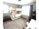 Neutral bedroom featuring a bunkbed with a pull-out trundle and a carpeted floor at 2831 Shadow Lake Rd, Lafayette, CO 80026