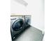 Functional laundry room with a side-by-side washer and dryer set, and neutral tile floor at 2831 Shadow Lake Rd, Lafayette, CO 80026