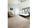 Spacious main bedroom with vaulted ceiling, neutral walls, ceiling fan and stylish patterned armchair at 2831 Shadow Lake Rd, Lafayette, CO 80026