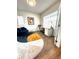 Cozy home office with a desk, chair, blue sofa, and ample natural light at 2831 Shadow Lake Rd, Lafayette, CO 80026