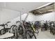A storage room filled with bikes parked in metal racks at 1196 N Grant St # 501, Denver, CO 80203