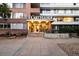 Attractive entrance to the Gotham Building with signage and landscaping at 1196 N Grant St # 501, Denver, CO 80203