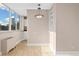 Light and bright dining room featuring a modern light fixture and city views at 1196 N Grant St # 501, Denver, CO 80203