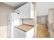 Functional kitchen area with white cabinets and ample counter space at 1196 N Grant St # 501, Denver, CO 80203