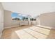 Spacious room with hardwood floors and expansive windows showcasing a skyline view at 1196 N Grant St # 501, Denver, CO 80203