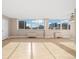 Bright, open living room with hardwood floors and large windows offering city views at 1196 N Grant St # 501, Denver, CO 80203