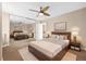 Spacious primary bedroom featuring mirrored closet doors, neutral carpeting and a ceiling fan at 1196 N Grant St # 501, Denver, CO 80203