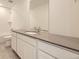 Bathroom featuring a large vanity with sink, ample countertop space, and modern fixtures at 7293 Waterleaf Trl, Littleton, CO 80125