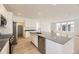 Modern kitchen boasts stainless steel appliances, a large island, and ample cabinet space at 7293 Waterleaf Trl, Littleton, CO 80125