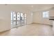 Bright living room features wood floors, recessed lighting, and a sliding door leading to the porch at 7293 Waterleaf Trl, Littleton, CO 80125