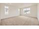 Spacious main bedroom featuring carpet and large windows offering great light at 7293 Waterleaf Trl, Littleton, CO 80125