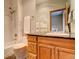 This bathroom features a shower and a wooden vanity with dark countertops at 2122 Montane Dr, Golden, CO 80401