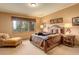 Cozy bedroom with a large window, comfortable bed, and charming decor at 2122 Montane Dr, Golden, CO 80401