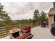 Spacious deck area with comfortable seating and gorgeous mountain views at 2122 Montane Dr, Golden, CO 80401