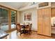Cozy dining area features wood floors, a round table, and access to the outdoor deck at 2122 Montane Dr, Golden, CO 80401