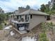 Exterior view of home featuring multiple decks, a hot tub, and tile roof at 2122 Montane Dr, Golden, CO 80401