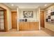 Hallway with kitchenette including wooden cabinets, microwave, and countertop at 2122 Montane Dr, Golden, CO 80401