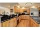 Well-equipped kitchen with granite countertops, stainless steel appliances, and wooden cabinetry at 2122 Montane Dr, Golden, CO 80401