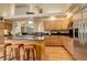 Bright kitchen features an island with bar seating, stainless steel appliances, and hardwood floors at 2122 Montane Dr, Golden, CO 80401