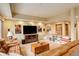 Living room with leather couches, wood accents, and natural light at 2122 Montane Dr, Golden, CO 80401