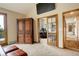 Home office, with large desk, inside home with a large armoire in the living area at 2122 Montane Dr, Golden, CO 80401