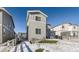 Gray two-story home with a backyard and snowy lawn at 5332 Blue Lunar Ln, Castle Rock, CO 80104