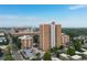 Stunning aerial view of the condo building in a developed urban area on a clear day at 955 Eudora St # 1606, Denver, CO 80220