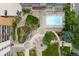 Aerial view showcasing the community pool, lounge area, and landscaped gardens within the residential complex at 955 Eudora St # 1606, Denver, CO 80220