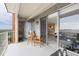 Balcony with an outdoor seating area and sliding glass doors with a view of the city at 955 Eudora St # 1606, Denver, CO 80220