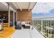 Charming balcony with outdoor seating offering great city views, featuring brick and wrought iron details at 955 Eudora St # 1606, Denver, CO 80220