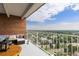 Inviting outdoor balcony with city views, brick wall, and comfortable seating, perfect for relaxation at 955 Eudora St # 1606, Denver, CO 80220