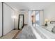 Comfortable bedroom with a large closet, opening to a private balcony, and natural light at 955 Eudora St # 1606, Denver, CO 80220