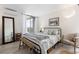 Inviting bedroom with comfortable bedding, a large window for natural light, and stylish decor at 955 Eudora St # 1606, Denver, CO 80220
