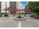 Beautifully landscaped courtyard with seating areas, a central fountain, and lush greenery at 955 Eudora St # 1606, Denver, CO 80220