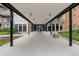 Building entrance featuring a covered walkway, landscaped greenery and a bench at 955 Eudora St # 1606, Denver, CO 80220
