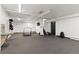 Bright gym area with exercise equipment, including mini trampolines and weight rack, on carpeted floor at 955 Eudora St # 1606, Denver, CO 80220