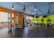Spacious gym with colorful walls and ceilings, including exercise equipment and treadmills at 955 Eudora St # 1606, Denver, CO 80220