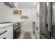 Well-equipped kitchen featuring stainless steel appliances, white cabinets, and ample counter space at 955 Eudora St # 1606, Denver, CO 80220