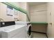 Clean laundry room equipped with modern washer and dryer, and practical counter space at 955 Eudora St # 1606, Denver, CO 80220