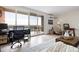 Cozy living room with a balcony, providing a relaxing space with natural light and views of the surrounding scenery at 955 Eudora St # 1606, Denver, CO 80220
