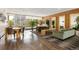 Comfortable lobby area with dining table, sofas, chairs, plants, mirrors and wood-style flooring at 955 Eudora St # 1606, Denver, CO 80220