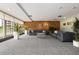Inviting lobby area showcasing comfortable seating arrangements, potted plants, and a brick accent wall at 955 Eudora St # 1606, Denver, CO 80220
