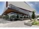 The restaurant exterior showcases an inviting outdoor patio and contemporary architecture, in a bustling urban setting at 955 Eudora St # 1606, Denver, CO 80220