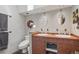Bathroom with double sinks, modern toilet and tile, offering a practical and aesthetically pleasing space at 1686 S Logan St, Denver, CO 80210